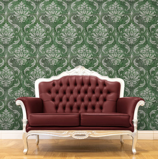 green prepasted wallpaper with damask pattern and a fancy looking sofa